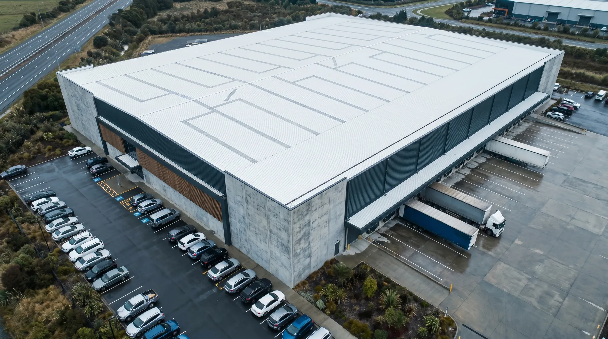 Aerial view of a Hornby commercial warehouse with a completed white TPO flat roof.